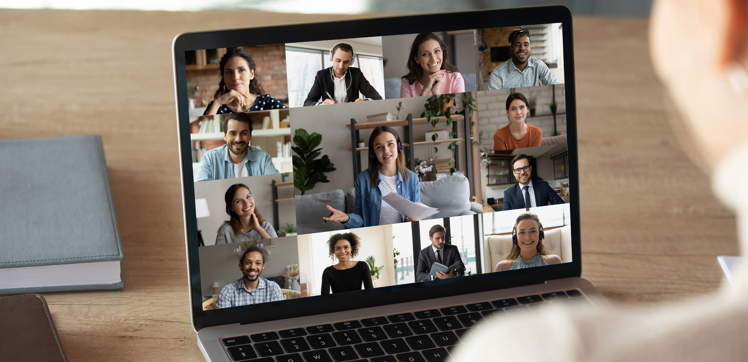 a photo of a group Zoom meeting on a laptop